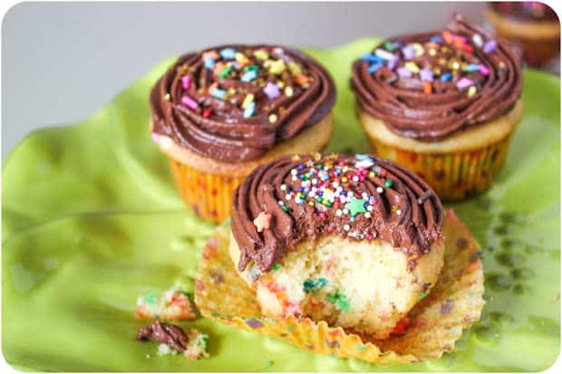 sprinkle yellow cupcakes with milk chocolate buttercream