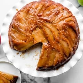 apple upside down cake with 1 slice removed