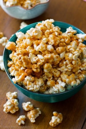 peanut butter caramel corn in a teal bowl