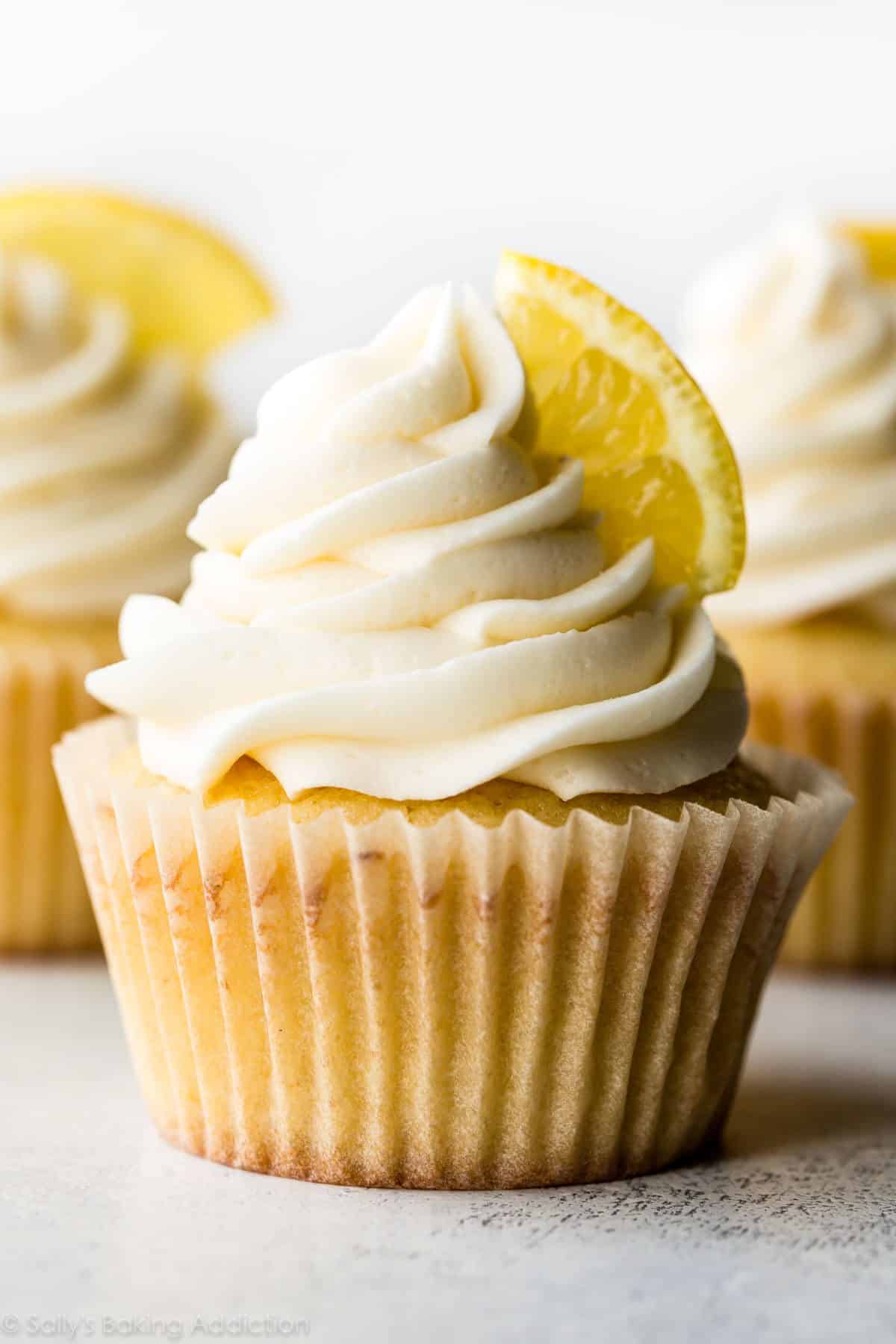 lemon cupcake topped with vanilla buttercream and a lemon slice