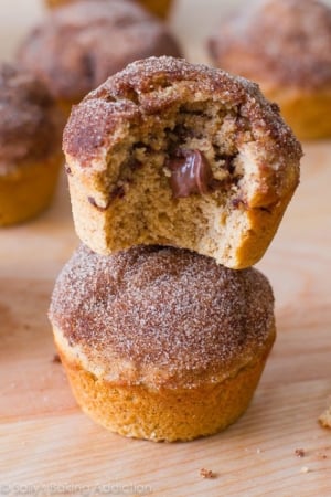 stack of cinnamon sugar muffins stuffed with Nutella with a bite taken out of one showing the middle