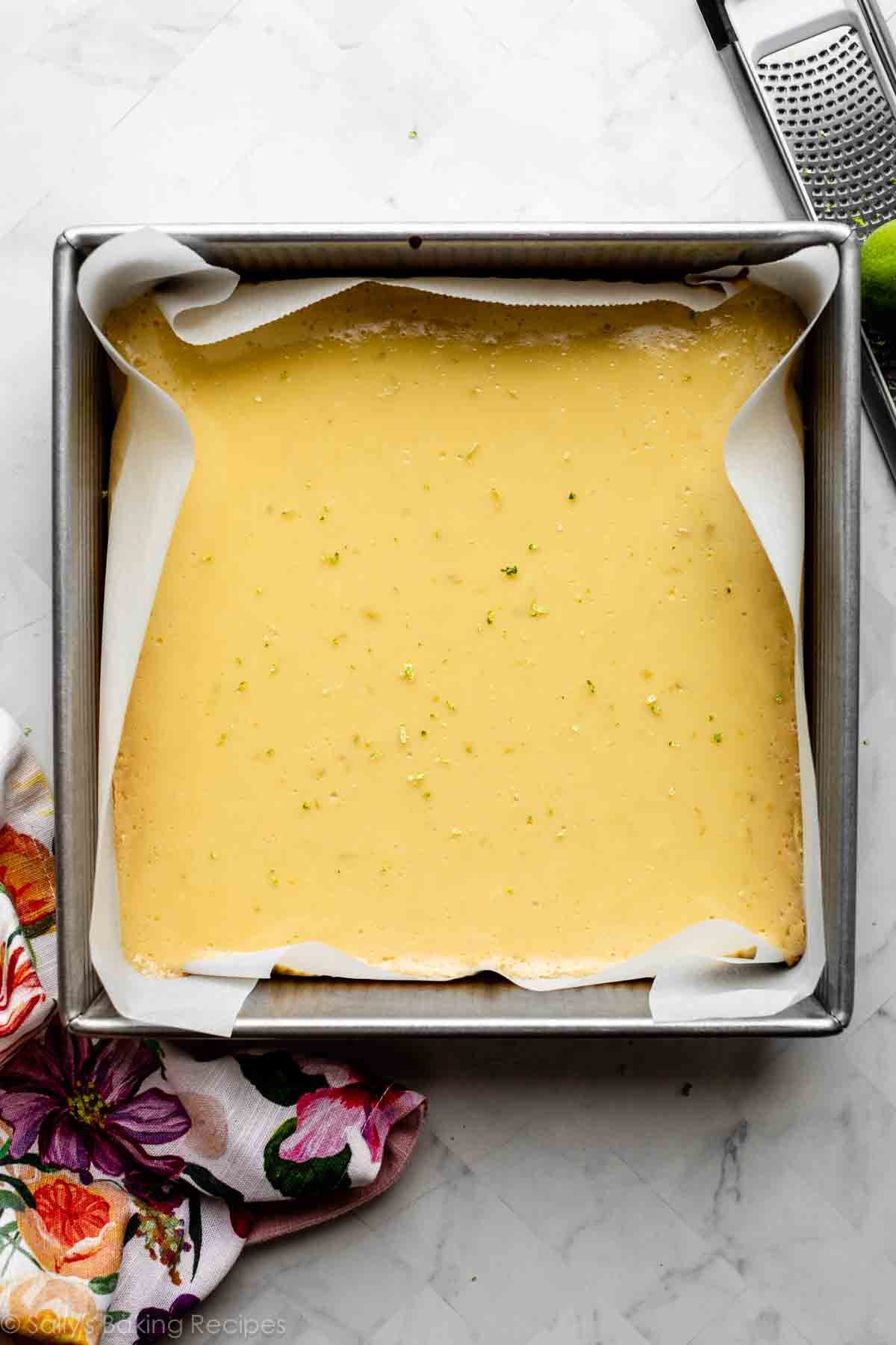 square baking pan with baked key lime bars not cut yet.