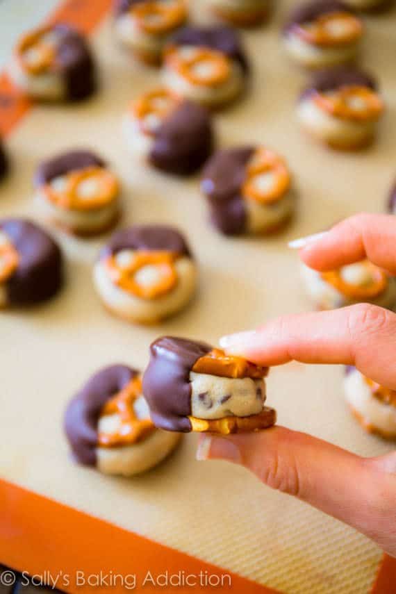 hand holding a cookie dough pretzel bite