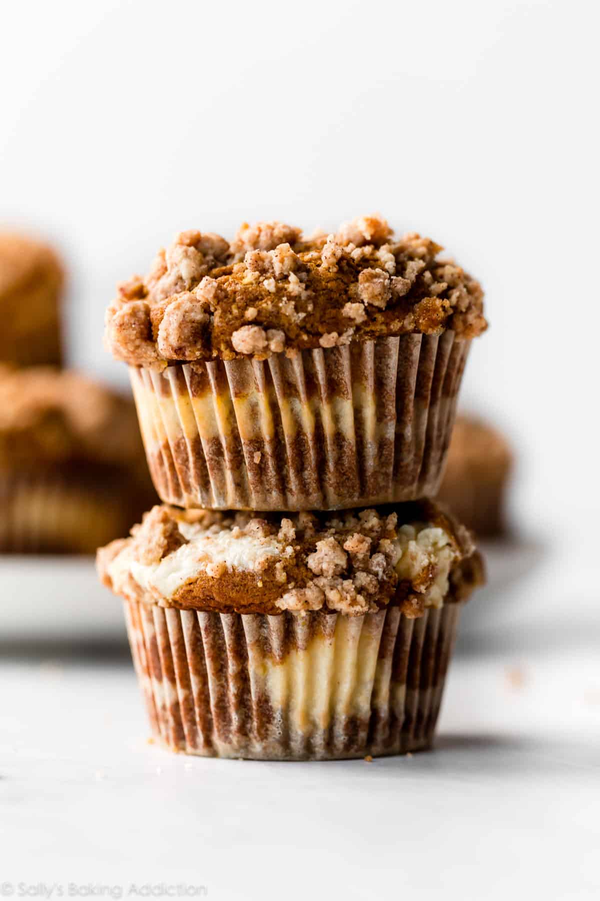 stack of pumpkin cheesecake muffins