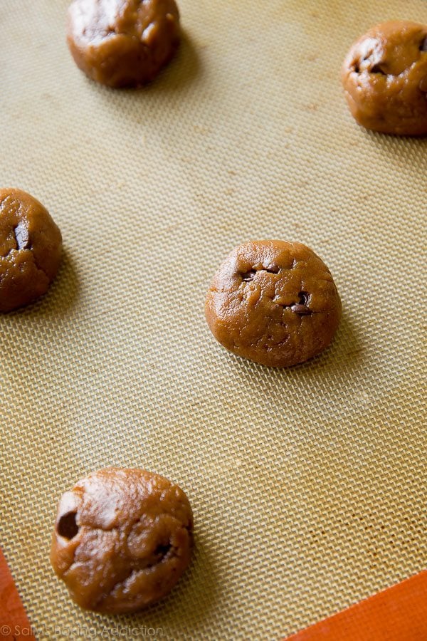 cookie dough balls on a silpat baking mat