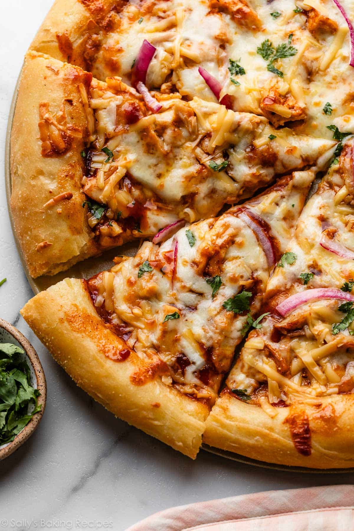 BBQ chicken pizza with fresh cilantro on top.