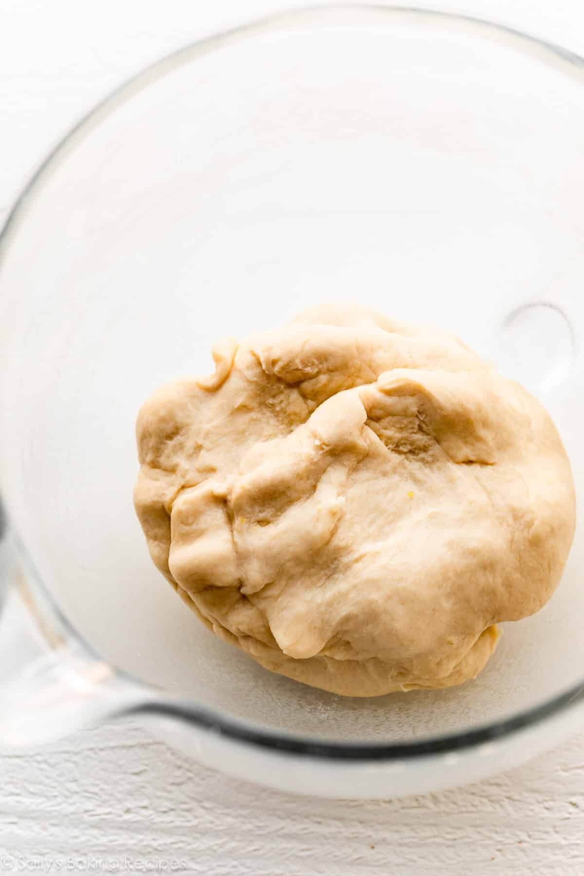 ball of dough in glass bowl.