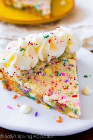 slice of funfetti sugar cookie cake on a white plate