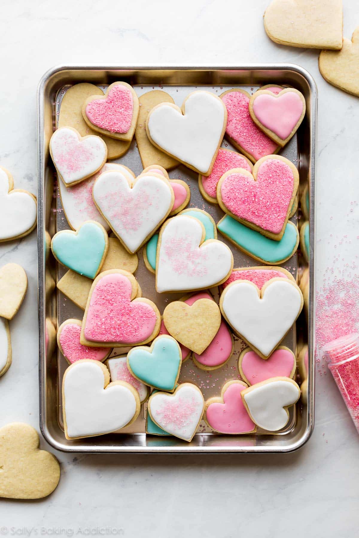 decorated sugar cookies on a baking sheet