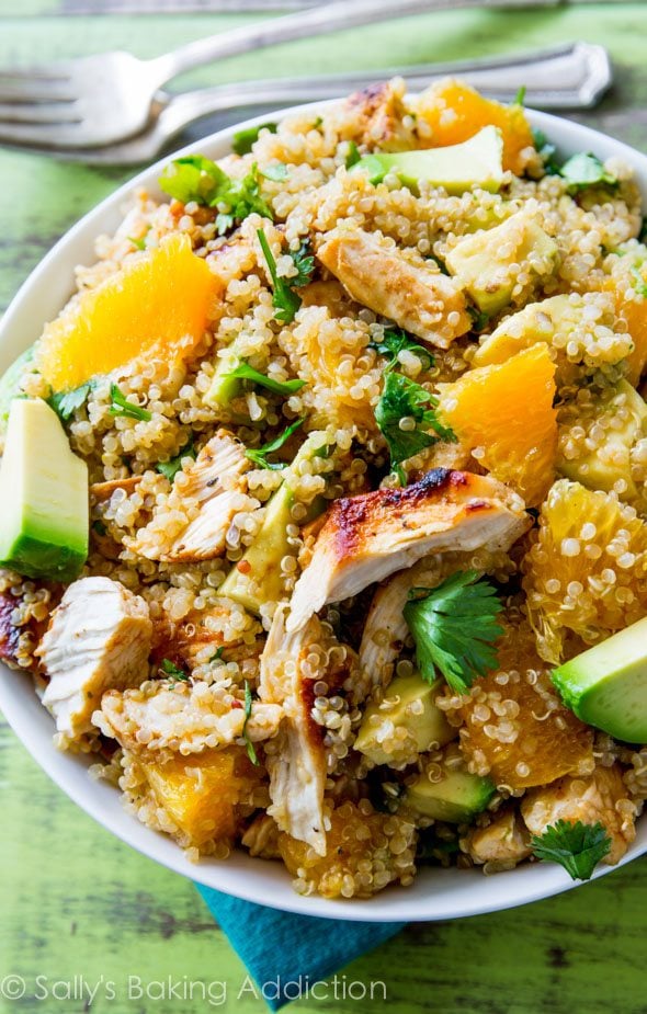 citrus chicken quinoa salad in a white bowl