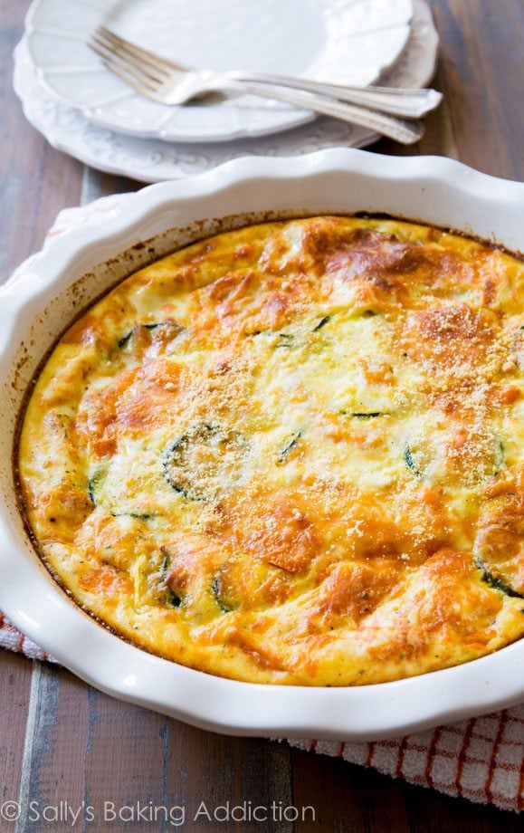 crustless veggie quiche in a white baking dish