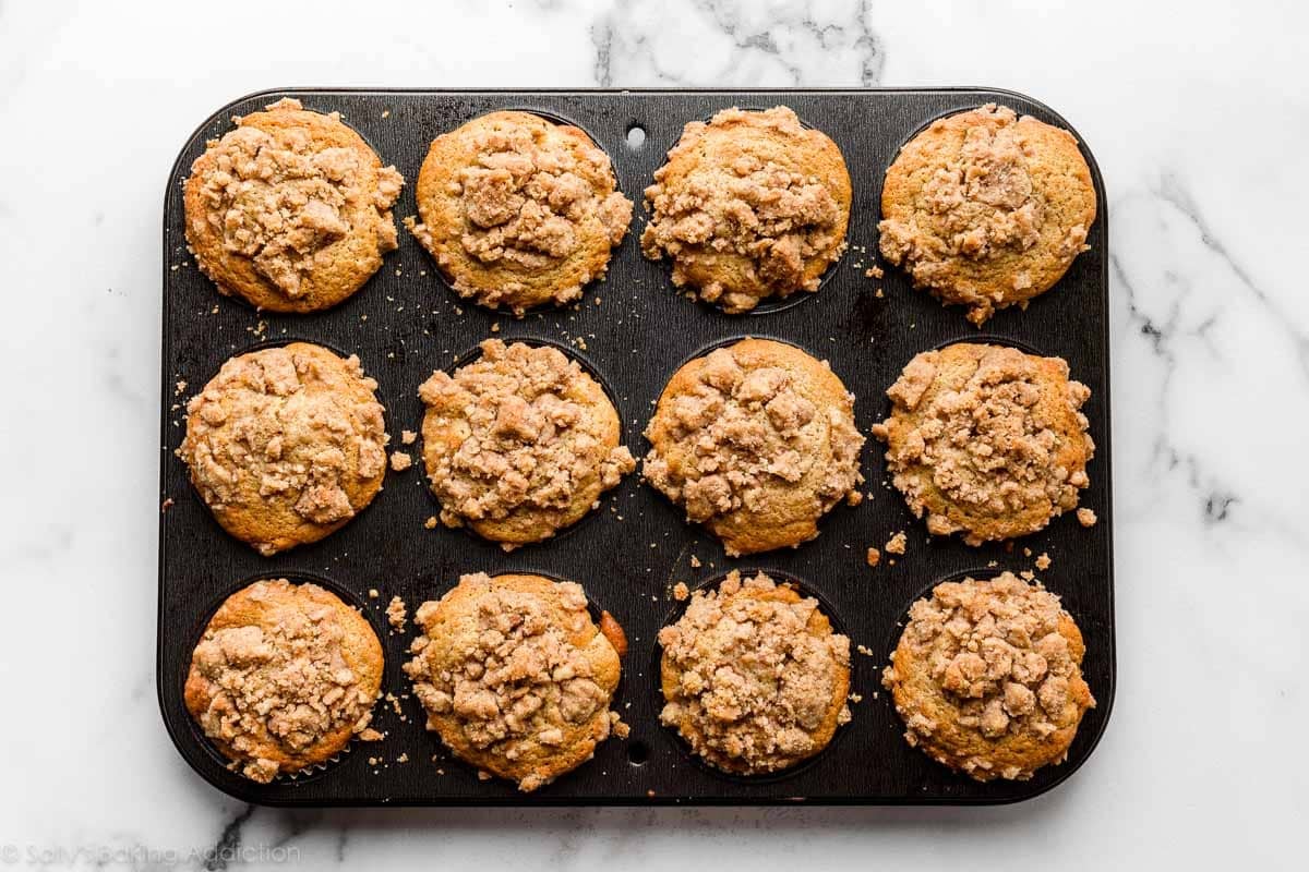 baked apple cinnamon muffins in muffin pan