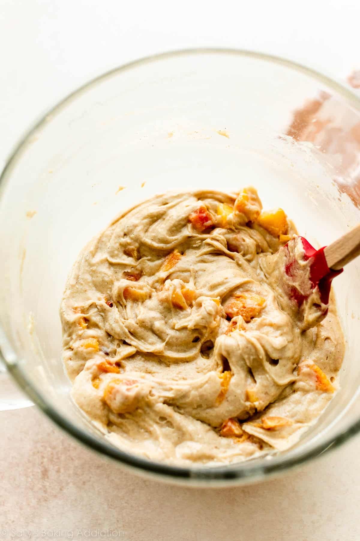 peach batter in glass bowl.