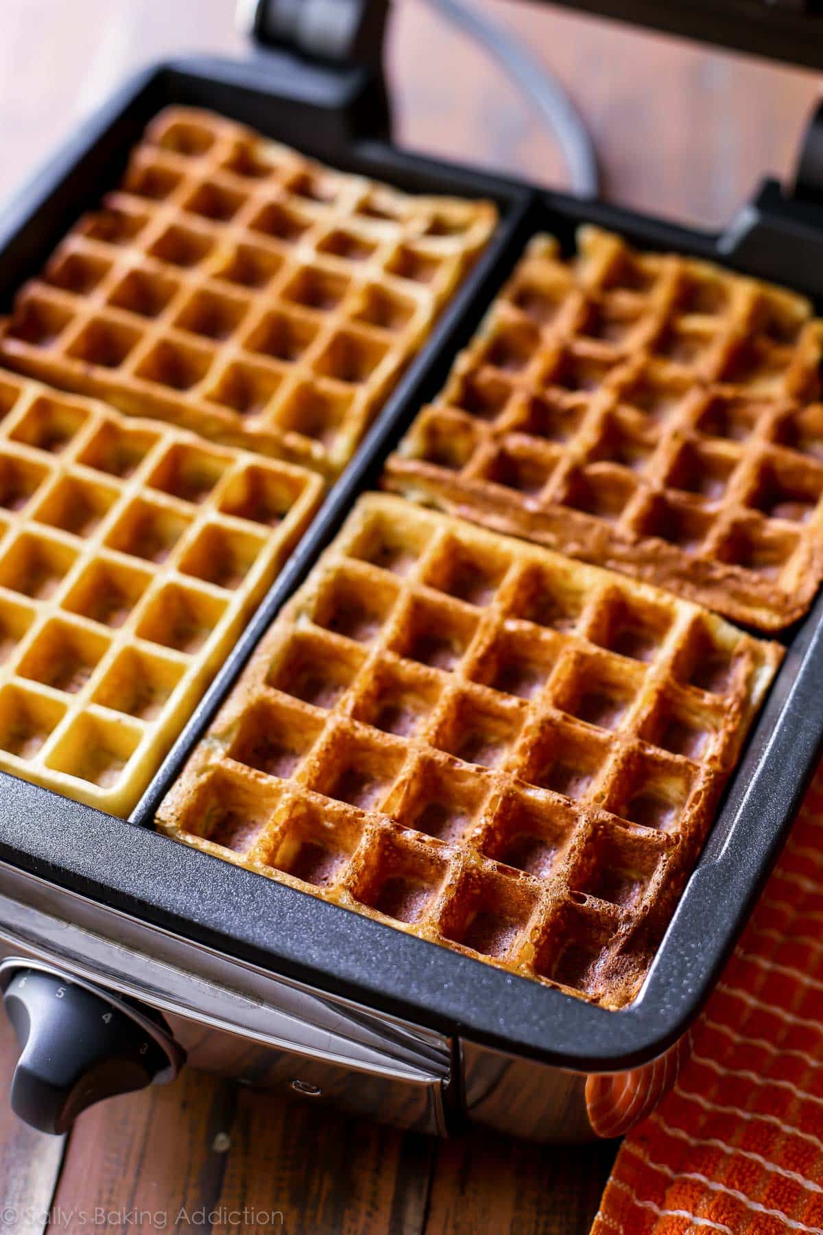 buttermilk waffles in a waffle maker after cooking