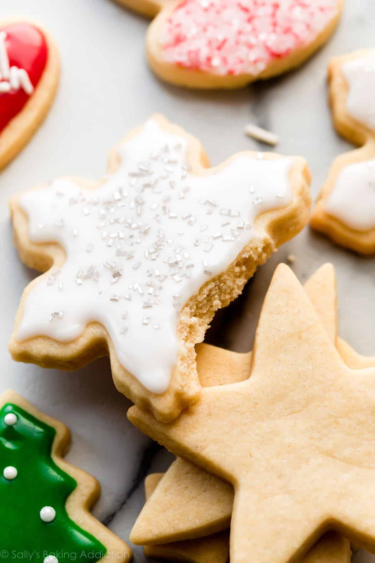 Iced snowflake sugar cookie broken in half.