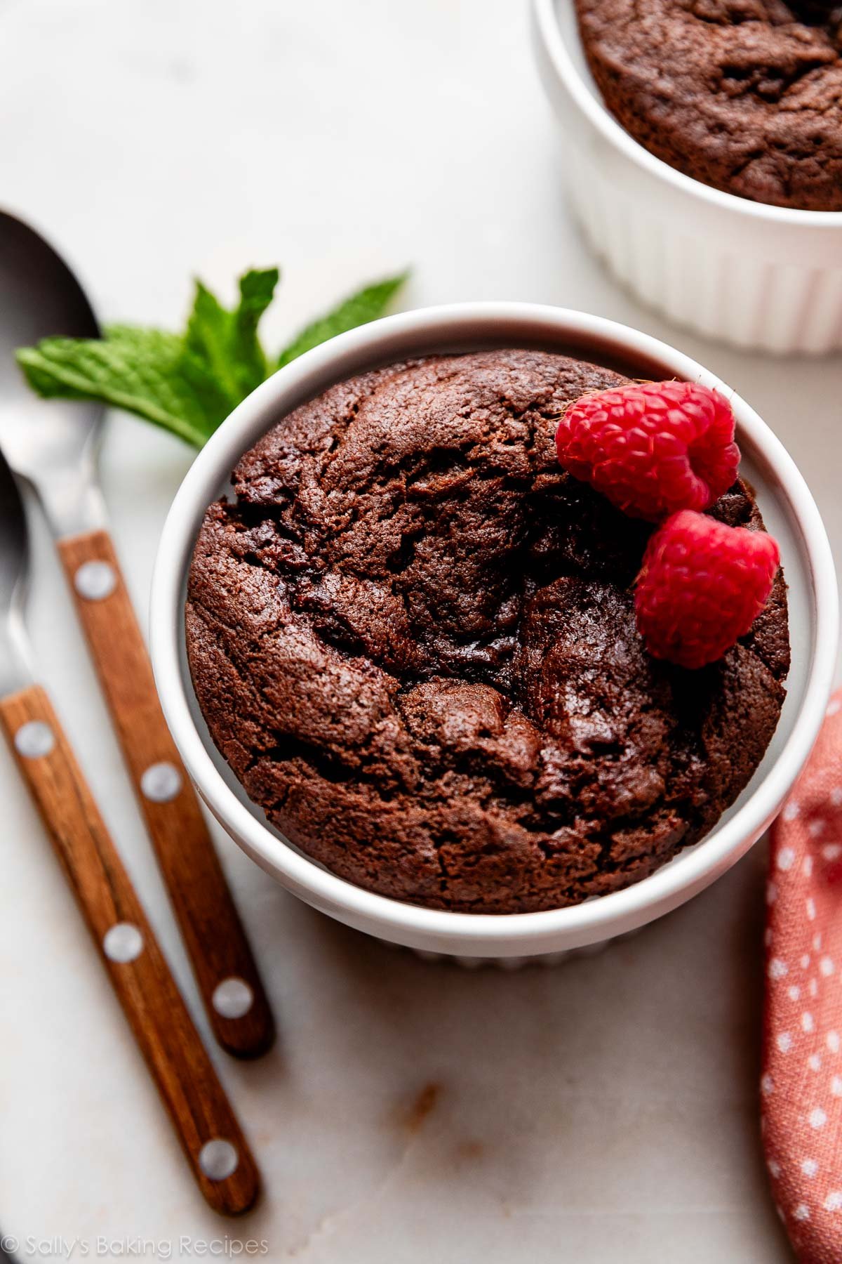 chocolate ramekin cake with fresh raspberries on top.