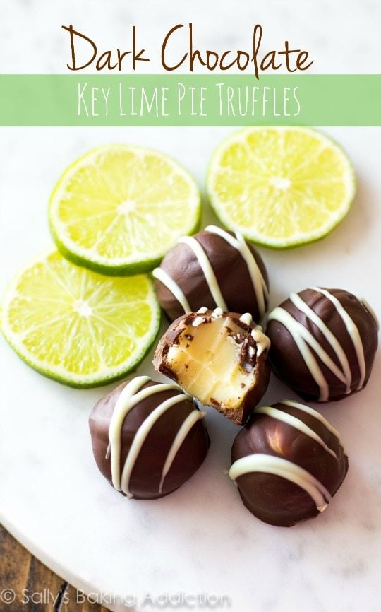 dark chocolate key lime pie truffles on a white serving platter with a bite taken from one showing the inside with text overlay that says dark chocolate key lime pie truffles