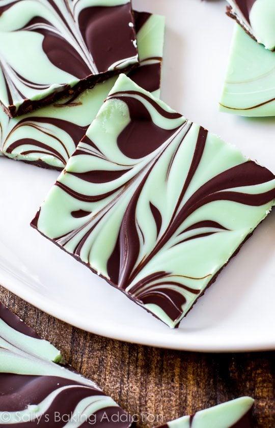 pieces of mint chocolate swirled bark on a white serving tray