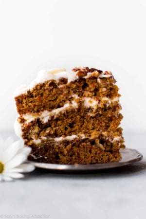 slice of carrot cake with cream cheese frosting on a plate