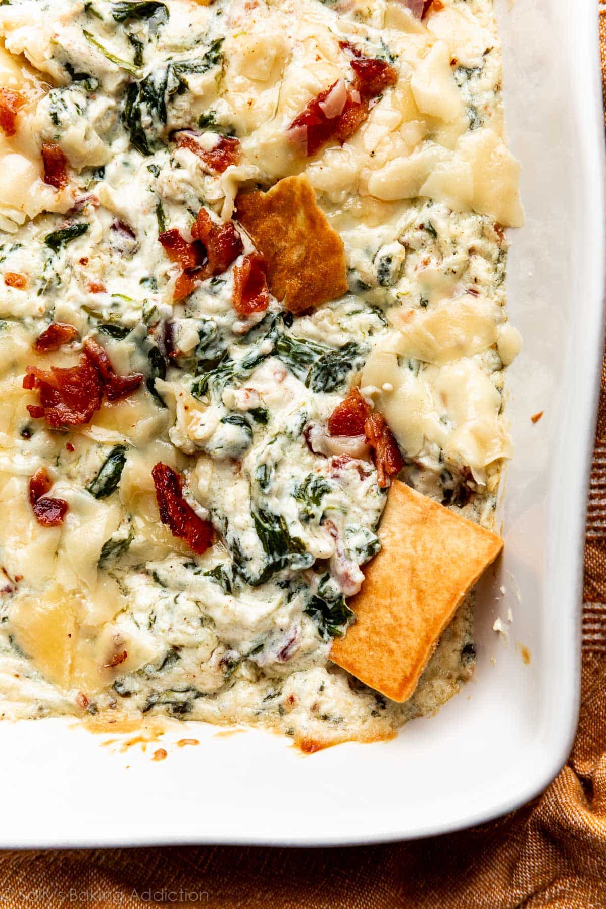 warm roasted garlic spinach dip with pita chip