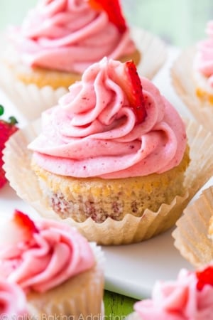 strawberry cupcakes topped with strawberry frosting