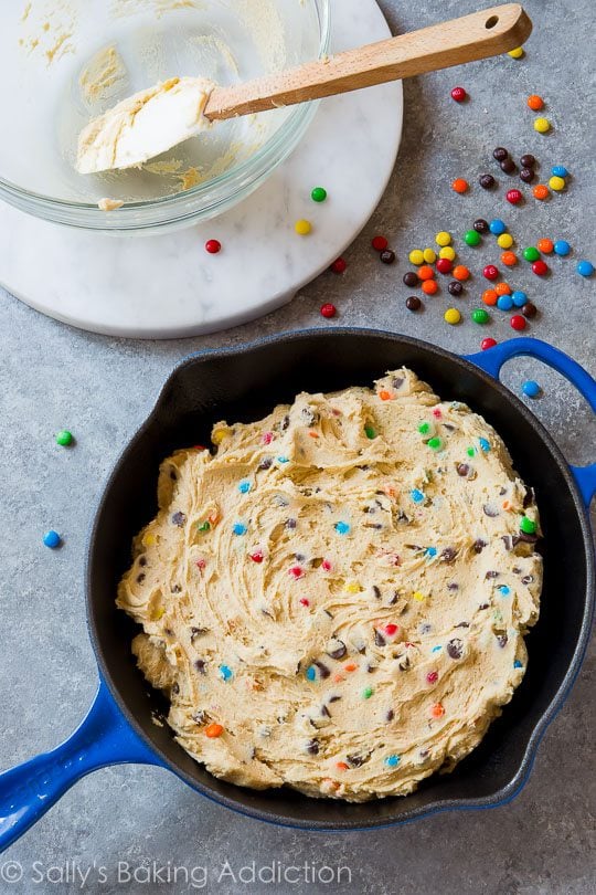 cookie dough in blue skillet before baking