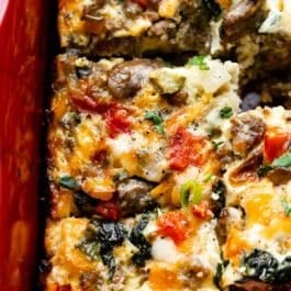 breakfast egg casserole with peppers, spinach, mushrooms, and cheese.