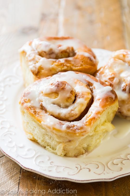 maple cinnamon rolls on a white plate