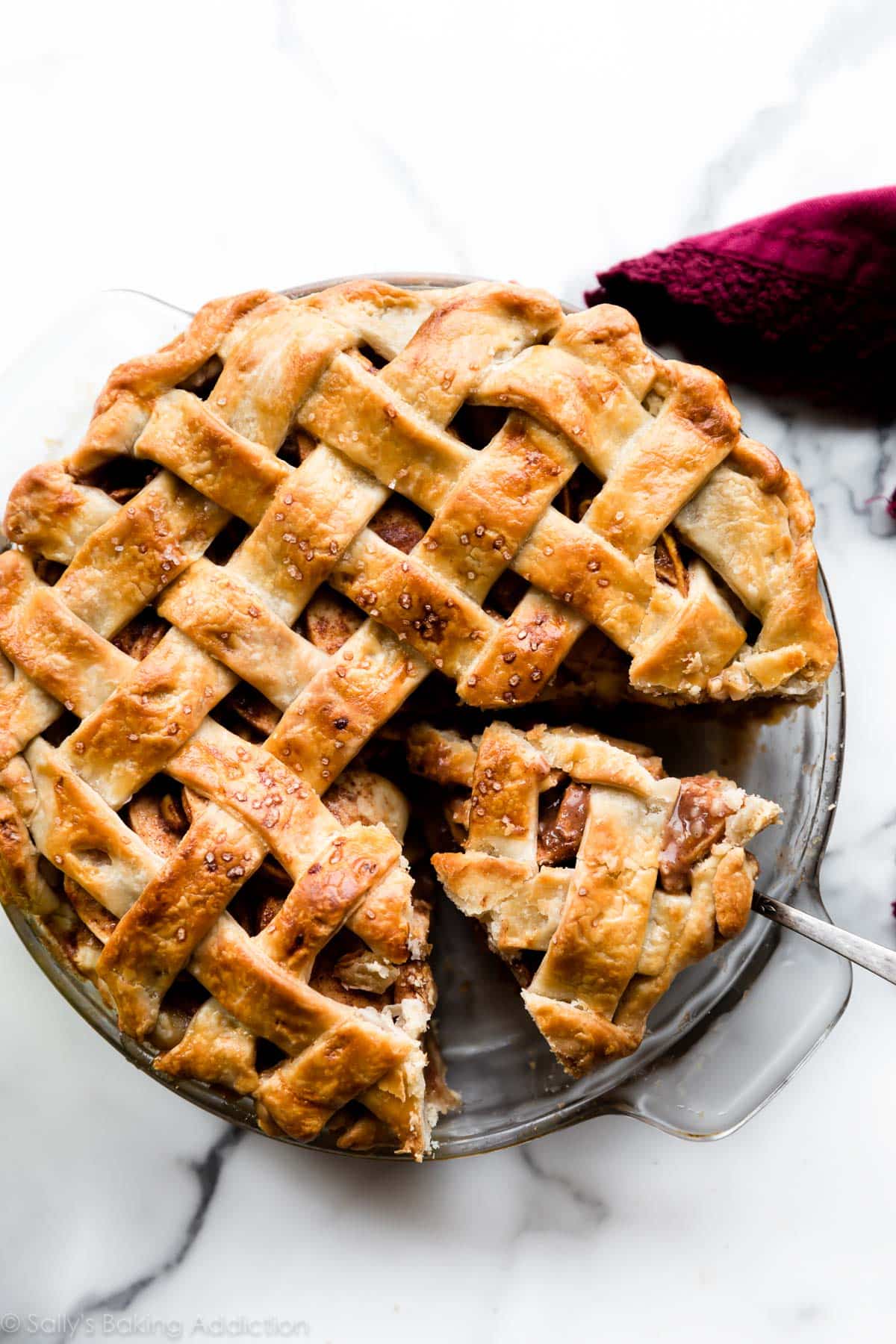 chai spice apple pie with a slice on a pie server