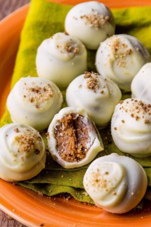 white chocolate pumpkin spice truffles on an orange plate