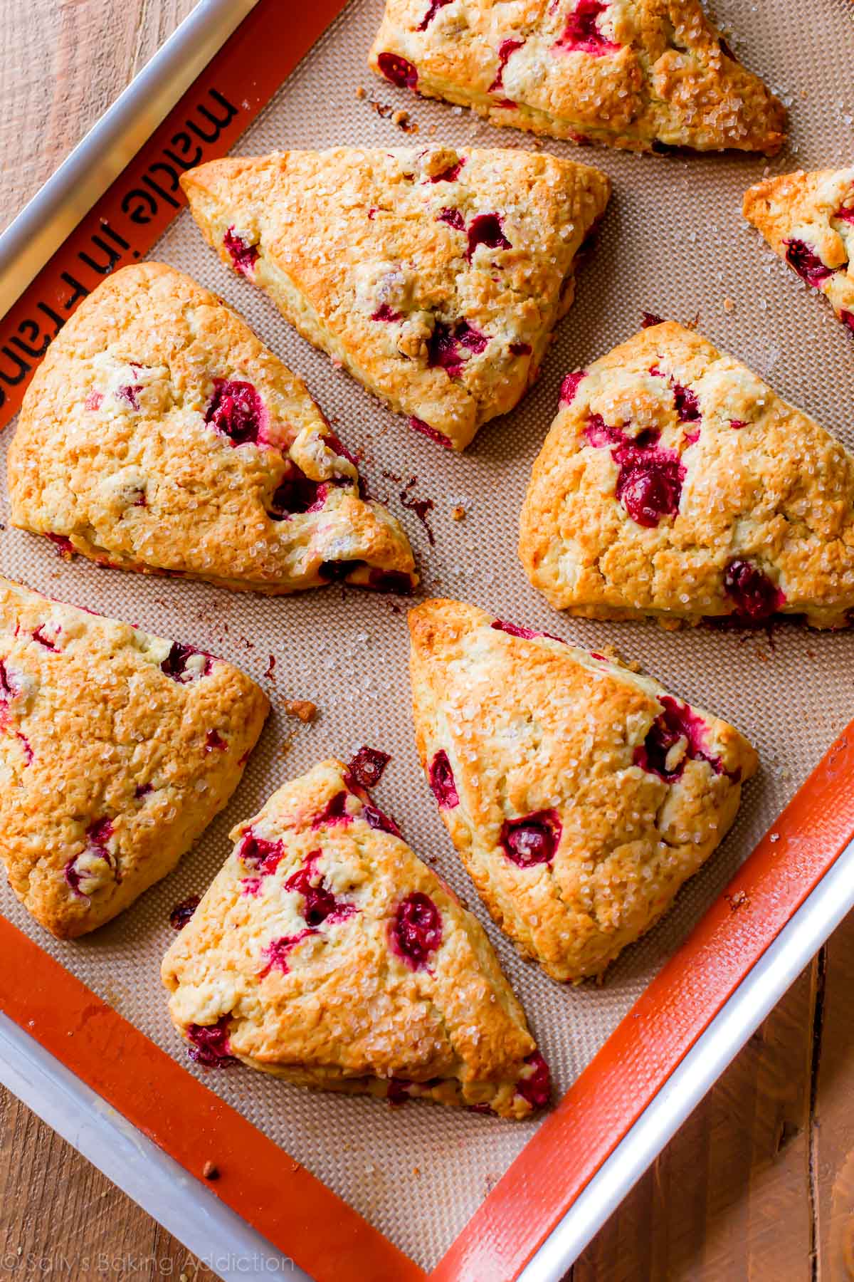 cranberry orange scones on baking sheet