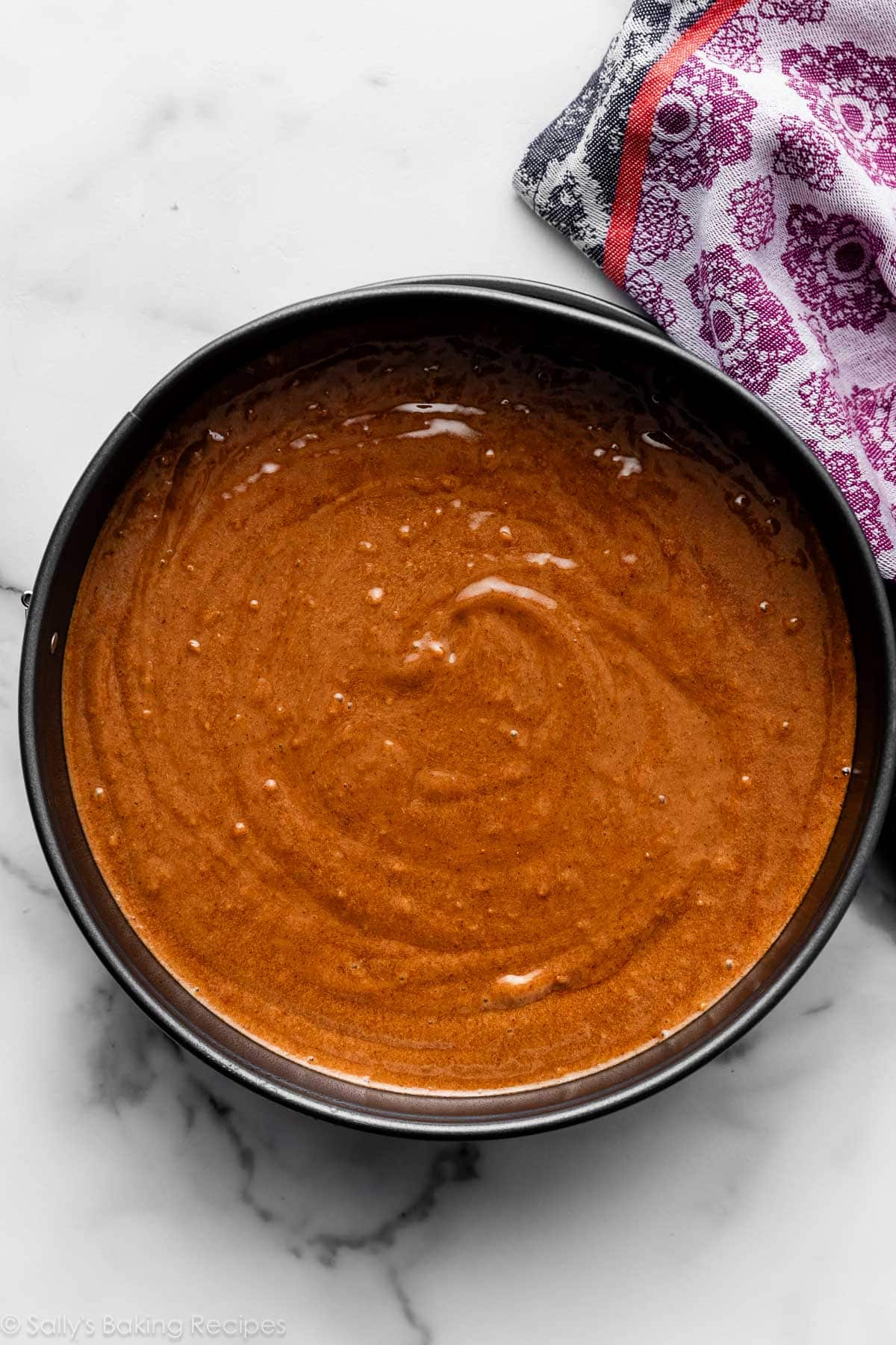 gingerbread cake batter in cake pan.