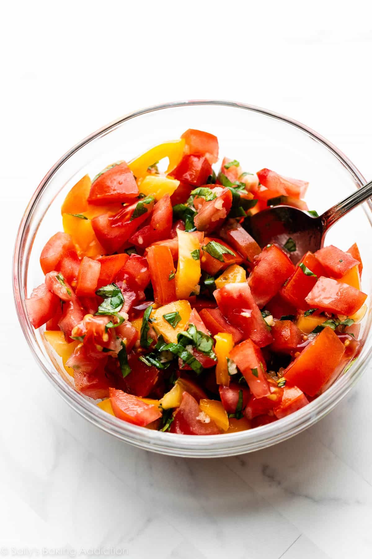 homemade bruschetta mixture in glass bowl.