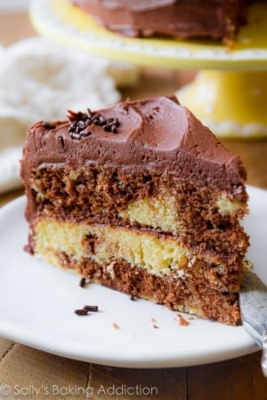 slice of marble layer cake on a white plate