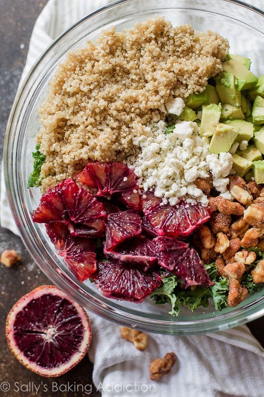 salad ingredients in a glass bowl before mixing