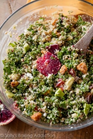 blood orange avocado quinoa & kale salad in a glass bowl