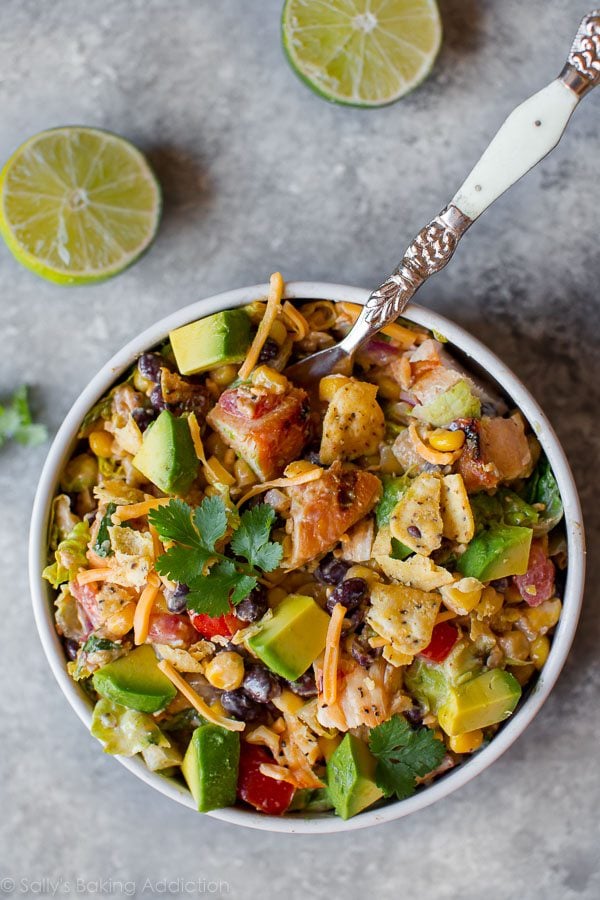 overhead image of southwestern chopped chicken salad in a white bowl with a fork