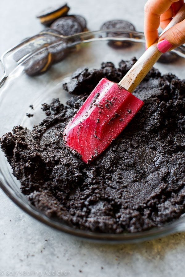 spreading Oreo cookie crust into glass pie dish