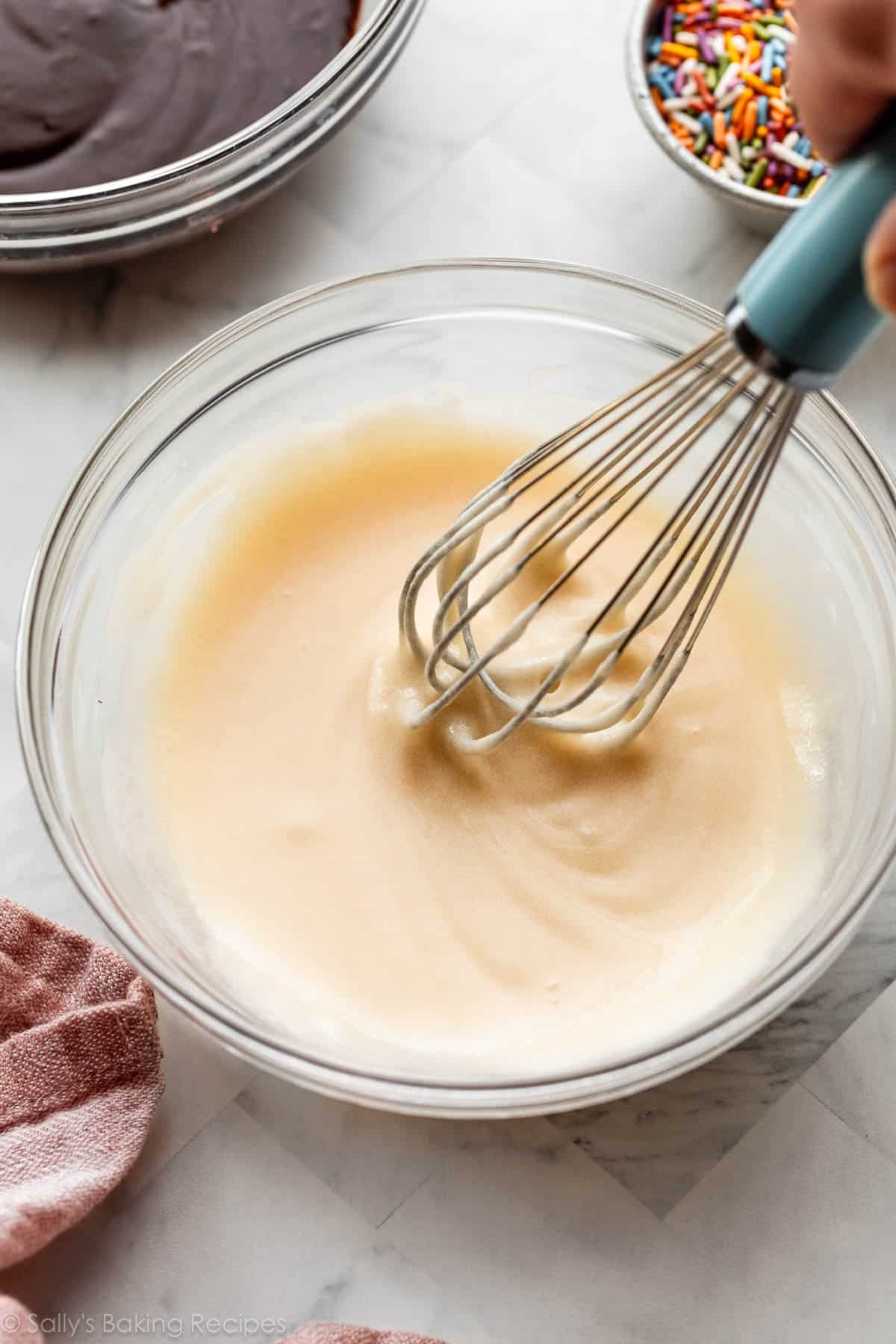 vanilla doughnut frosting glaze in glass bowl.