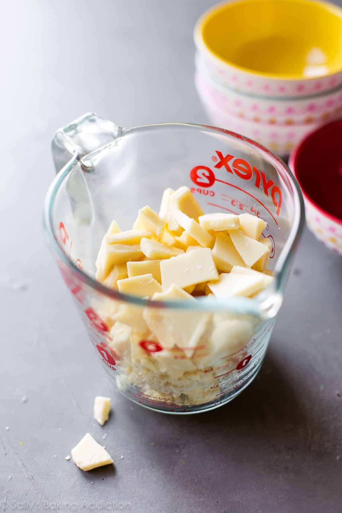 chopped white chocolate in a glass measuring cup