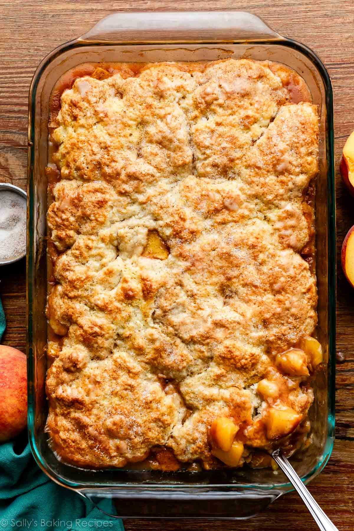 peach cobbler in glass baking pan.