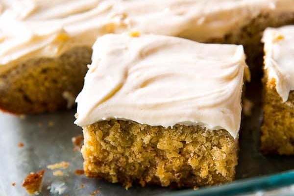 slice of banana cake in a glass baking dish