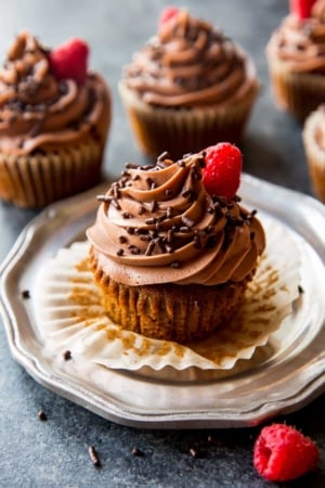 mocha Nutella cupcakes on a silver plate with Nutella frosting and chocolate sprinkles