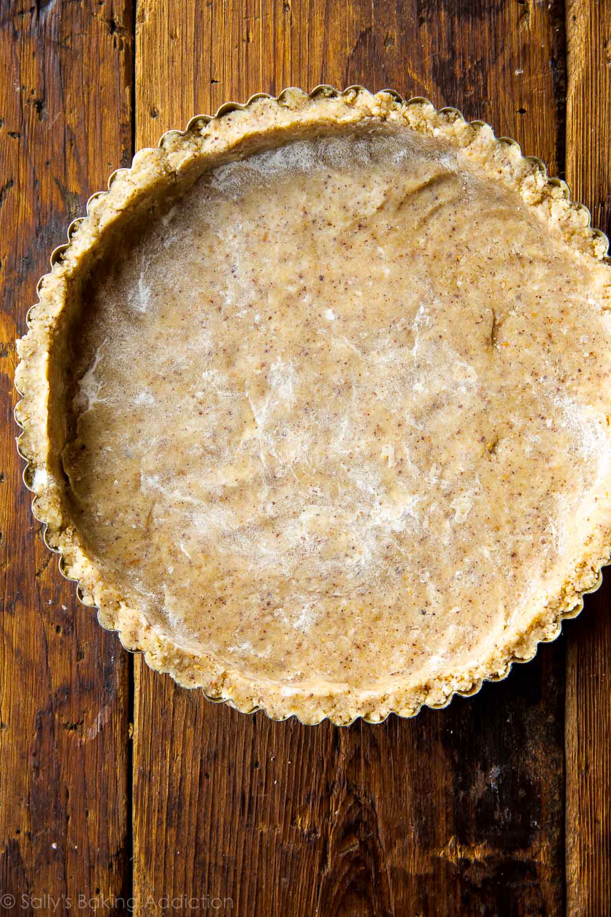 toasted hazelnut crust pressed into a tart pan before baking