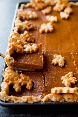 pumpkin slab pie with a slice on a dessert server