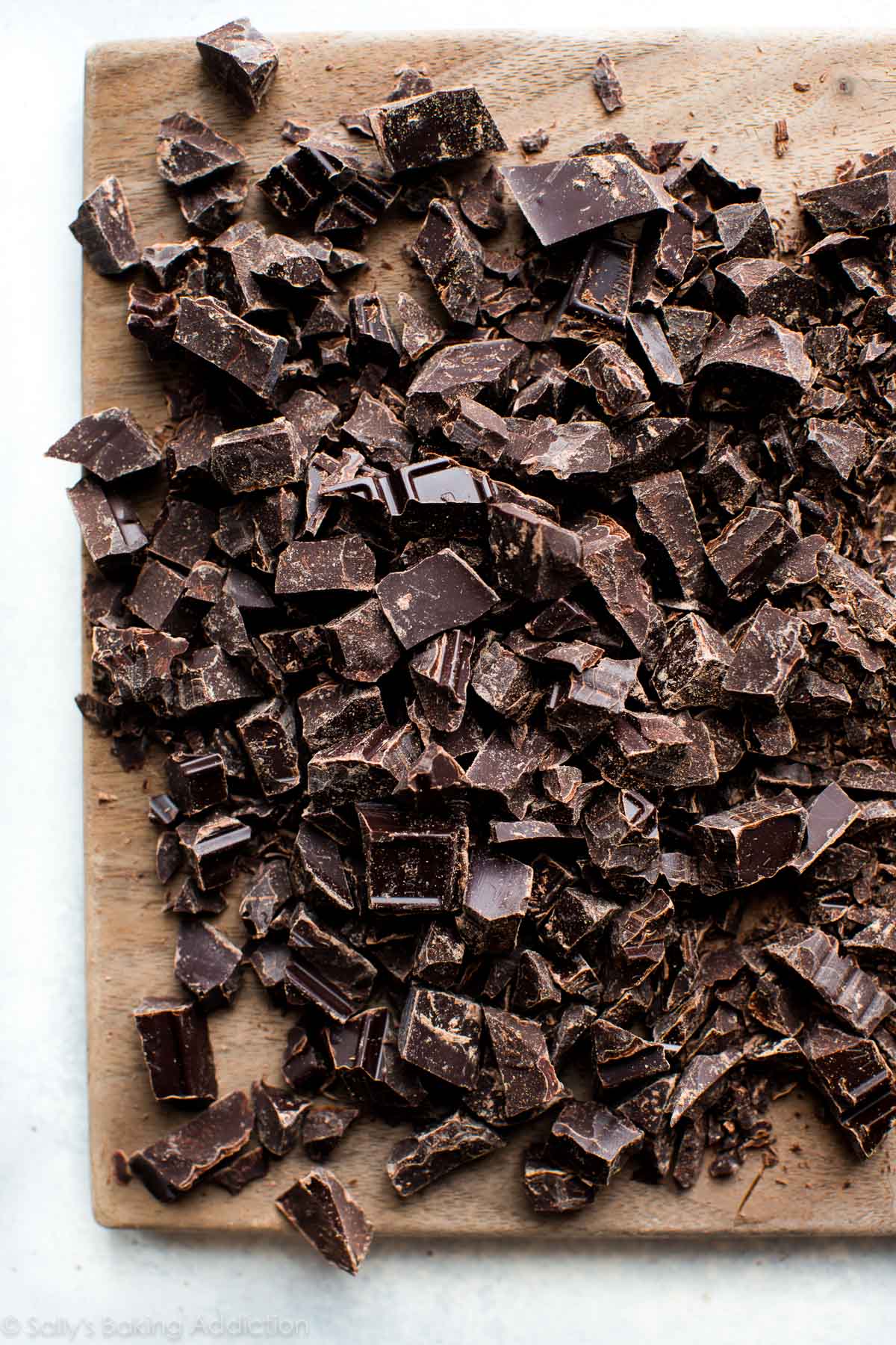 chopped chocolate on a wood cutting board