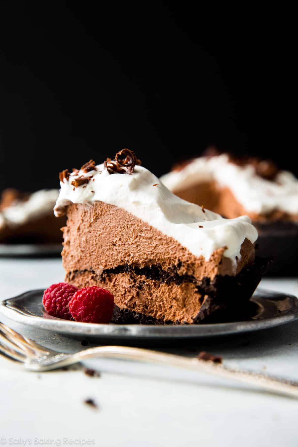 slice of chocolate mousse pie on a silver plate with a fork.