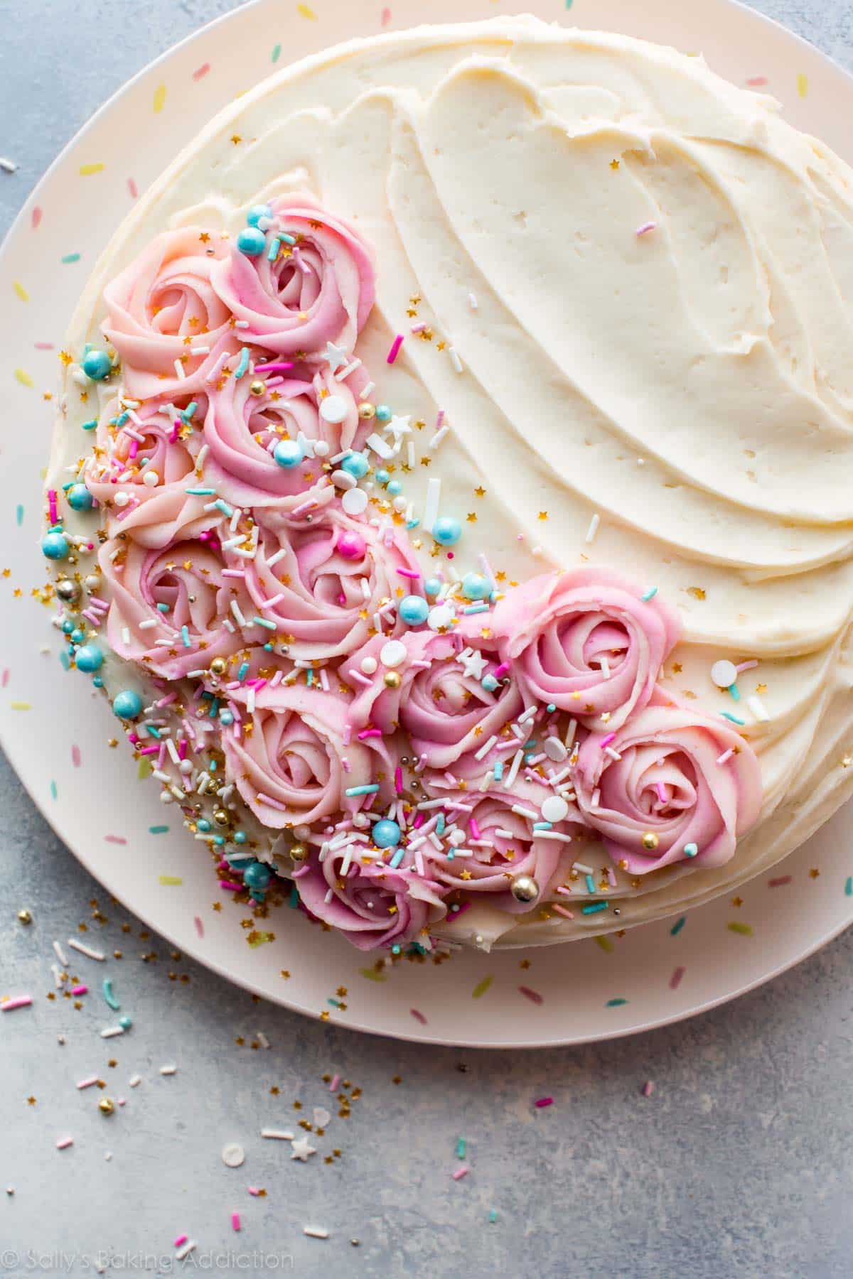 overhead image of a cake with frosting roses on top