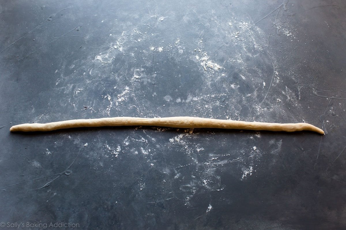 piece of soft pretzel dough rolled out into a long rope