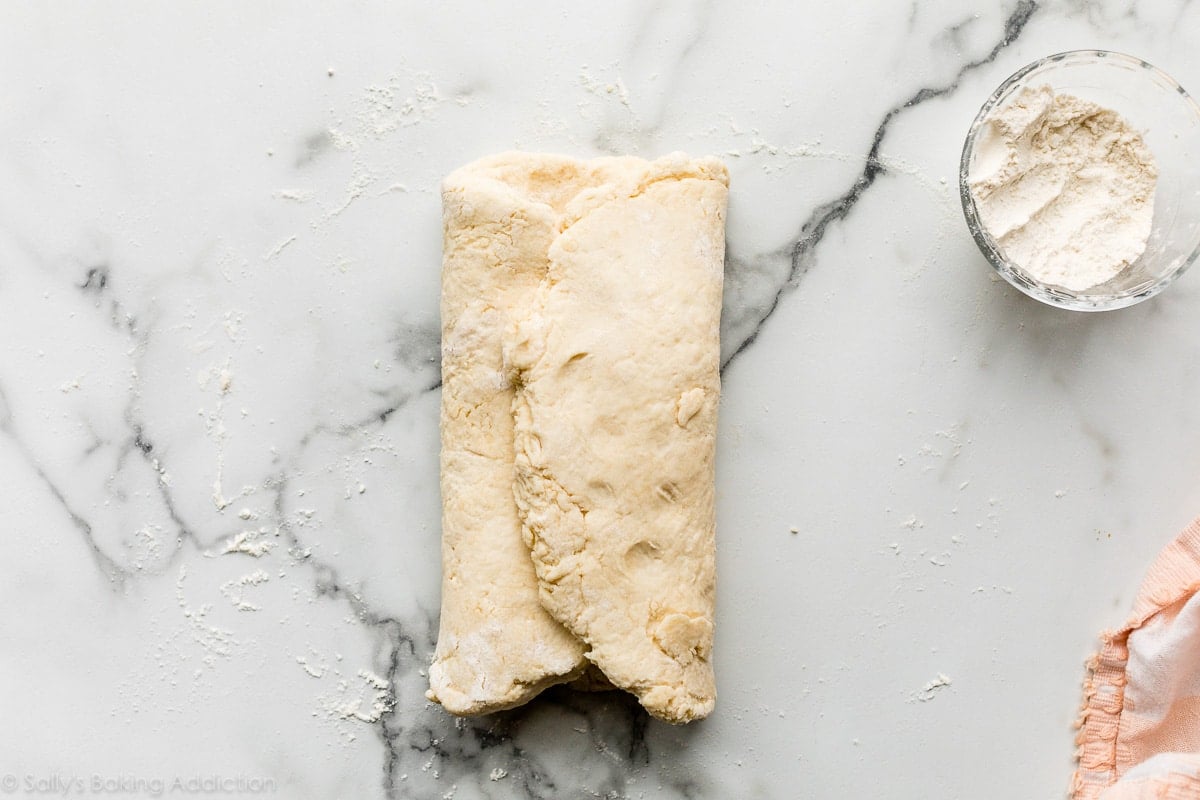 folded dough on marble counter